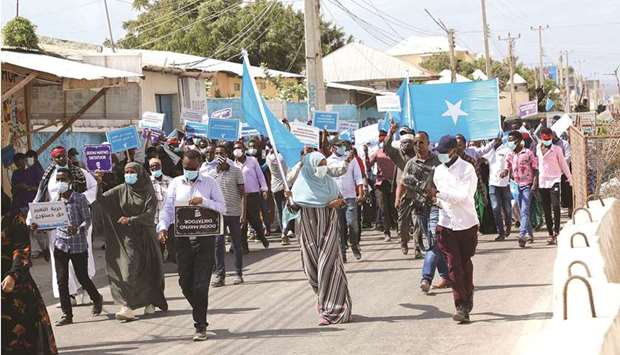 Supporters of different opposition presidential candidates demonstrate in Mogadishu, yesterday.