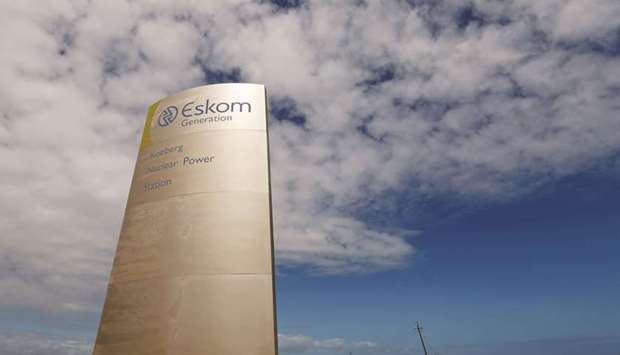 The logo of state power utility Eskom  is seen outside Cape Townu2019s Koeberg nuclear power plant (file). Eskom, described by Goldman Sachs Group as the biggest threat to the South African economy, has become mired in debt as a result of overspending on projects.