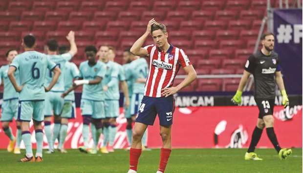 Atletico Madridu2019s Spanish midfielder Marcos Llorente reacts to Levanteu2019s second goal during their La Liga match at the Wanda Metropolitano Stadium in Madrid yesterday. (AFP)