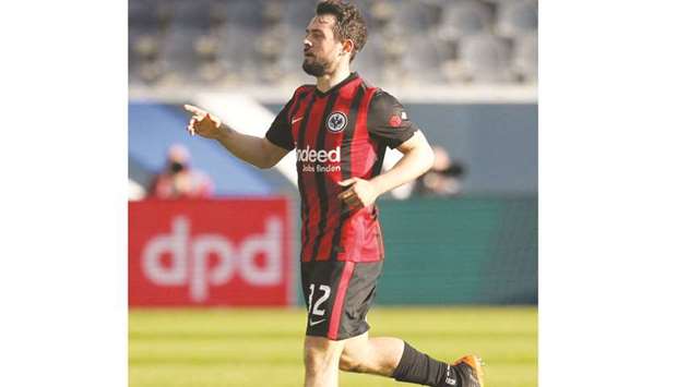 Eintracht Frankfurtu2019s midfielder Amin Younes celebrates after scoring against Bayern Munich in their Bundesliga match yesterday. (AFP)