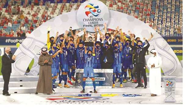 In this December 19, 2020, picture, Ulsan Hyundai players celebrate winning the AFC Champions League in the presence of FIFA President Gianni Infantino (left), AFC President Sheikh Salman bin Ibrahim al-Khalifah and QFA President HE Sheikh Hamad bin Khalifa bin Ahmed al-Thani (right) at Al Janoub Stadium. (Reuters)