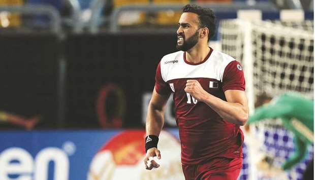 Qataru2019s right back Frankis Marzo celebrates after scoring during the 2021 World Menu2019s Handball Championship quarter-final against Sweden in Cairo on January 27, 2021. (AFP)