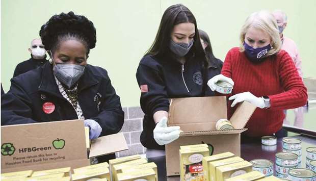 (L-R ) Congresswomen Sheila Jackson Lee, Alexandria Ocasio-Cortez and Sylvia Garcia help distribute food at the Houston Food Bank yesterday in Houston, Texas.