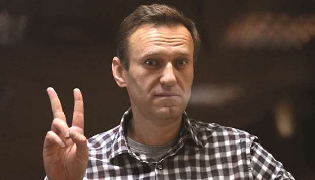 Navalny gestures from inside a glass cell during a court hearing at Moscowu2019s Babushkinsky district court.