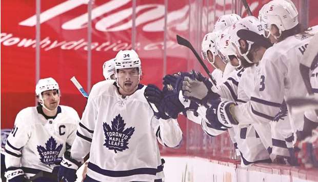 Toronto Maple Leafsu2019 Auston Matthews celebrates his goal against Montreal Canadiens with teammates during the second period at Bell Centre in Montreal. (USA TODAY Sports)