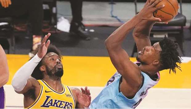 Miami Heat forward Jimmy Butler shoots over Los Angeles Lakers guard Wesley Matthews during the fourth quarter at the Staples Center in Los Angeles. (USA TODAY Sports)