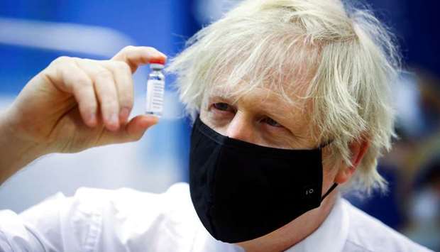 Britain's Prime Minister Boris Johnson visits a vaccination centre at Cwmbran Stadium