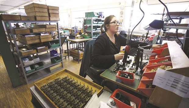 An employee works on the cuckoo-clock production line at the Burger Group gearmaker and automobile component factory in Schonach, Germany (file). Ifo said its business climate index increased to 92.4 from an upwardly revised 90.3 in January, hitting its highest level since October and surpassing even the strongest forecast in a Reuters poll of analysts.