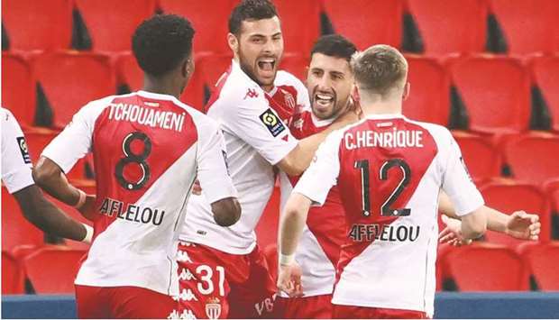 Monacou2019s Guillermo Maripan (second right) celebrates with teammates after scoring against Paris Saint-Germain. (AFP)