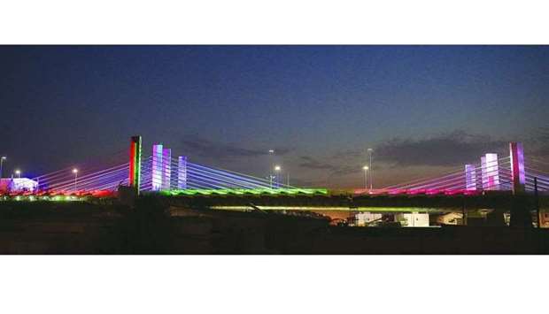 The cable-stayed bridge on Sabah Al Ahmad Corridor all decked up in colourful lights and the national flags of Qatar and Kuwait Tuesday night. PICTURES: Shaji Kayamkulam.