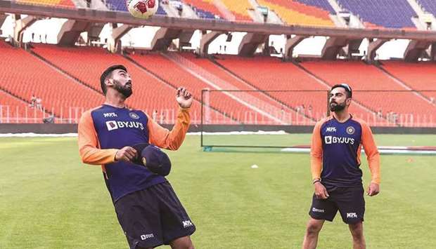 Indiau2019s K.L. Rahul and Virat Kohli play football during a training session yesterday.