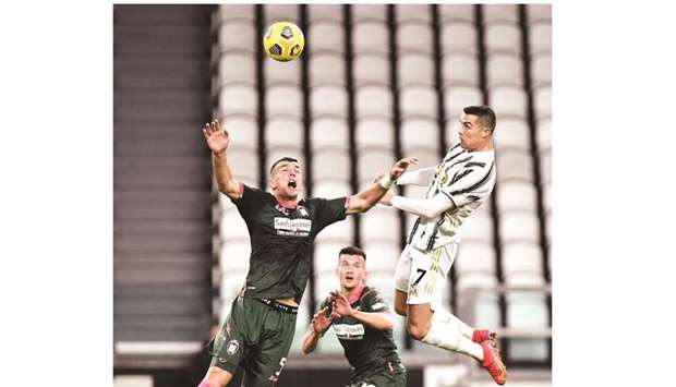 Juventusu2019 Cristiano Ronaldo (right) scores against Crotone in Serie A. (Reuters)