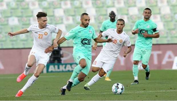 Al Ahli and Umm Salal players battle for the ball during their QNB Stars League match yesterday.