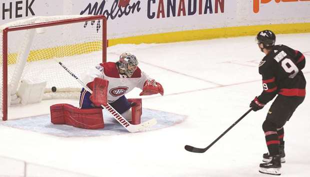 Ottawa Senators center Josh Norris scores against Montreal Canadiens goalie Carey Price in a shootout at the Canadian Tire Centre in Ottawa. (USA TODAY Sports)