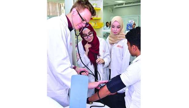 QU students working in lab