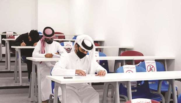 Students at QU campus taking exams by following all the precautions.