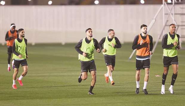 Al Sadd (left) and Al Duhail players train yesterday on the eve of the Qatar Cup final.