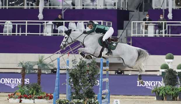 Belgiumu2019s Olivier Philippaerts astride H&M Legend of Love clears a hurdle during the Commercial Bank CHI Al Shaqab Presented by Longines at the Longines Arena at Al Shaqab yesterday.