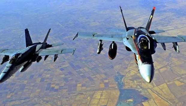 In this file US Navy handout image taken on October 4, 2014 two US Navy F-18E Super Hornets supporting operations against IS, are pictured after being refueled by a KC-135 Statotanker over Iraq after conducting an airstrike. AFP