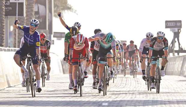 Sam Bennett (left) of Deceuninck Quick Step team wins the sixth stage of the UAE Cycling Tour from Dubai Deira Islands to Dubai-Palm Jumeriah yesterday. (AFP)