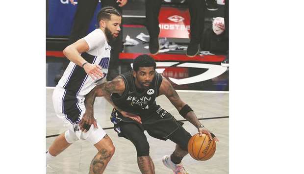 Kyrie Irving of the Brooklyn Nets dribbles against Michael Carter-Williams of the Orlando Magic during their NBA game at the Barclays Center in New York City. (Getty Images/AFP)