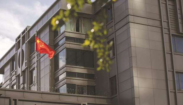 The Chinese flag stands on display outside the China Consulate General building in Houston, Texas (file). The US signalled it currently intends to go ahead with a Trump administration-proposed rule to secure the information-technology supply chain next month, a move that gives the Department of Commerce broad authority to prohibit transactions involving u201cforeign adversaries.u201d