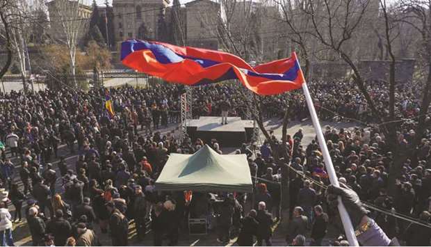 Opposition supporters hold a rally in Yerevan yesterday to demand the resignation of Armenian Prime Minister Pashinyan.