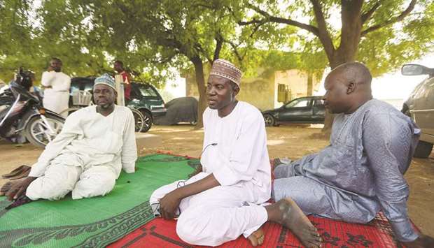 Some of the parents of the girls abducted from the Jangebe school are seen in Zamfara, Nigeria yesterday.