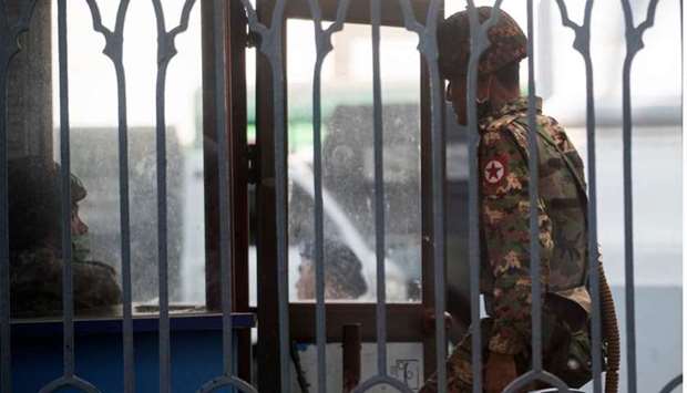 Myanmar soldiers stand inside Yangon City Hall after they occupied the building, in Yangon, Myanmar.