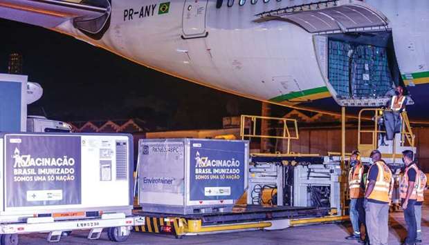 Refrigerated containers carrying AstraZeneca and the University of Oxford Covid-19 vaccines exit from a cargo aircraft at Galeao Air Base in Rio de Janeiro, Brazil. Global jet fuel markets pin their hopes on a rebound in air cargo demand and spur in international flights on mass vaccine roll-outs in several key countries this year.