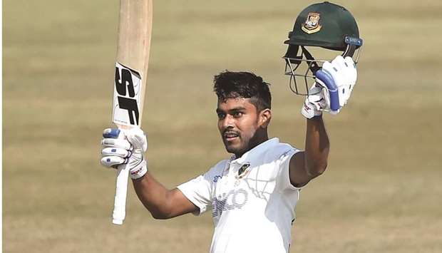 Bangladeshu2019s Mehidy Hasan celebrates after scoring a century during the second day of the first Test against West Indies at the Zohur Ahmed Chowdhury Stadium in Chittagong yesterday. (AFP)