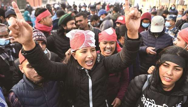 Protesters from the Nepal Communist Party chant slogans as they march during a general strike against the dissolution of the countryu2019s parliament, in Kathmandu yesterday.