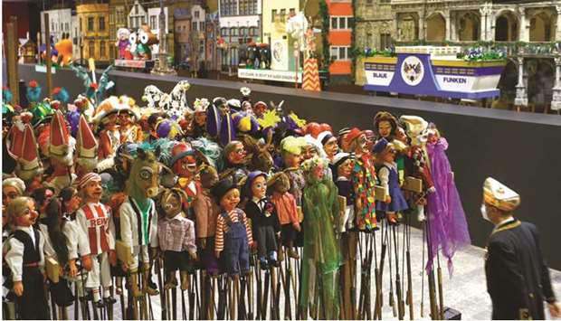 Wooden figures depicting carnival revellers and small-sized carnival floats seen yesterday during a preview of a miniature format Rose Monday parade in Cologne, Germany, which will be shown on TV after the famous traditional parade was cancelled due to the coronavirus pandemic.