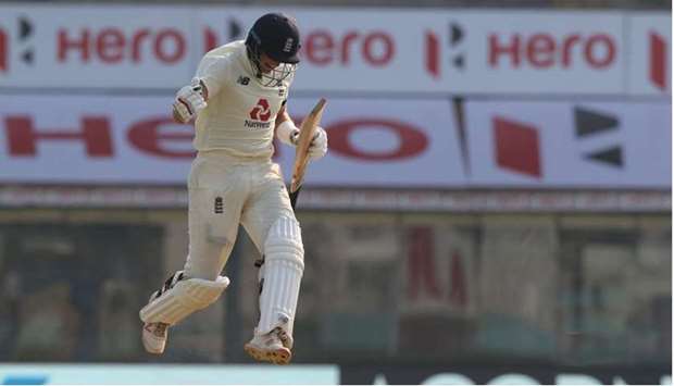 Englandu2019s Joe Root celebrates after reaching his century against India on the first day of the first Test in Chennai, India, yesterday. (BCCI)