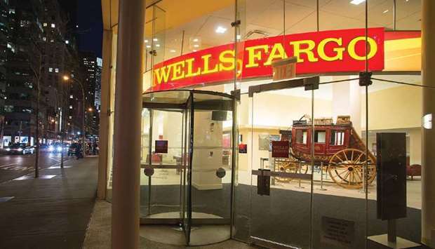 A Wells Fargo & Co bank branch is seen at night in New York. A race for talent is heating up as Wells Fargo winds down the roughly $40bn international segment of its wealth-management business, with several firms competing to scoop up advisers and their lucrative client lists.