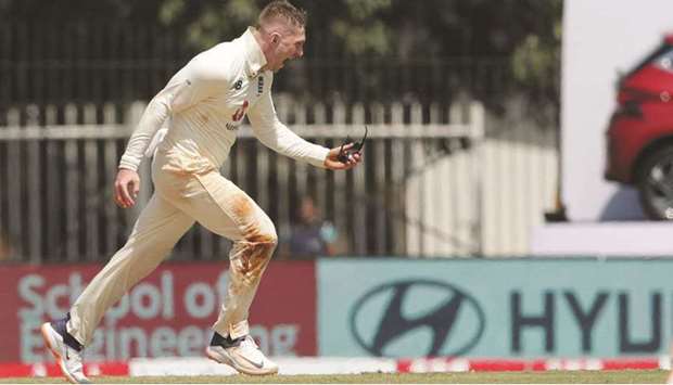 Englandu2019s Dom Bess celebrates the wicket of India captain Virat Kohli (not pictured) on third day of the first Test in Chennai yesterday. (BCCI)