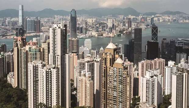 Residential and commercial buildings are seen from Victoria Peak in Hong Kong. The market regulator in Hong Kong proposed to tighten rules for brokerages handling stock and bond sales to clamp down on inflated orders and the chase after higher fees in the Asian financial hub.