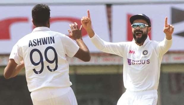 Ravichandran Ashwin and Virat Kohli celebrate the fall of an England wicket in Chennai yesterday. BCCI