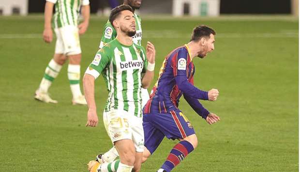 Barcelonau2019s Lionel Messi (right) celebrates after scoring against Real Betis at the Benito Villamarin stadium in Seville, Spain. (AFP)
