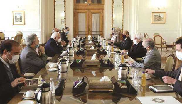 A handout picture provided by the Iranian foreign ministry shows Iranu2019s Foreign Minister Mohamed Javad Zarif (centre-left) during his meeting with Martin Griffiths (centre-right), special representative of the United Nationsu2019 secretary general for Yemen, in Tehran, yesterday.