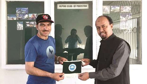 This undated picture shows Mohamed Ali Sadpara (left) with a member of Alpine Club of Pakistan in Islamabad.