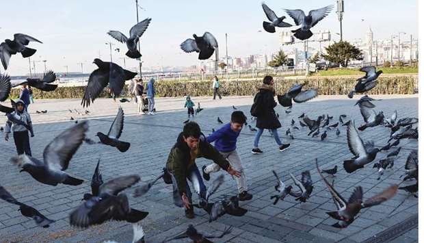 Children chase pigeons during a two-day curfew amid the spread of the coronavirus disease in Istanbul on February 6. Without the downturn in tourism due to the coronavirus pandemic and surging demand for gold, Turkey would have posted a surplus of $12.4bn.