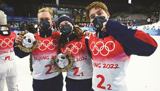 American gold medallists Ashley Caldwell, Christopher Lillis and Justin Schoenefeld pose after the freestyle skiing competitions at the 2022 Beijing Winter Olympics in Zhangjiakou, China, yesterday. (Reuters)