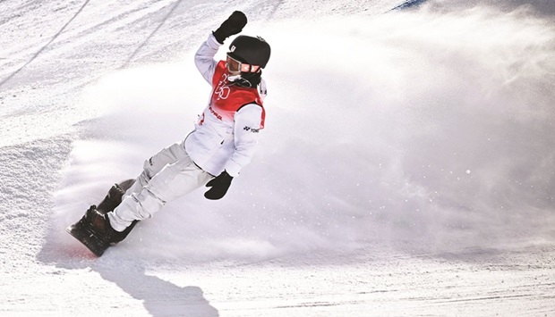 Japanu2019s Ayumu Hirano competes in the snowboard menu2019s halfpipe  final run during the Beijing 2022 Winter Olympic Games at the Genting Snow Park H & S Stadium in Zhangjiakou yesterday. (AFP)