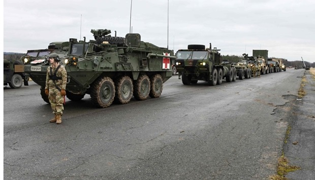 Various tactical vehicles assigned to the 2nd Squadron, 2nd Cavalry Regiment await to be loaded onto trucks at the 7th Army Training Commandu2019s Rose Barracks Air Field, Vilseck, Germany. The Squadron will deploy to Romania in the coming days to augment the more than 900 US service members already in Romania. AFP/US Army/HANDOUT/Gertrud Zach