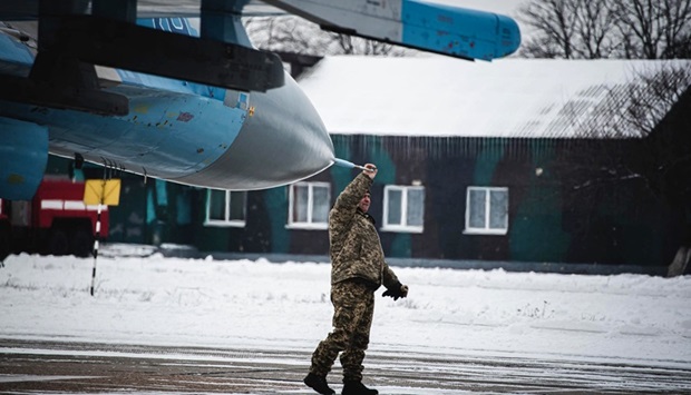 This handout picture taken and released by press-service of Ministry of Defence Ukraine shows a Sukhoi Su-27 plane of air tactical aviation brigade of Ukraine prior flights in Myrhorod region on February 11, 2022.