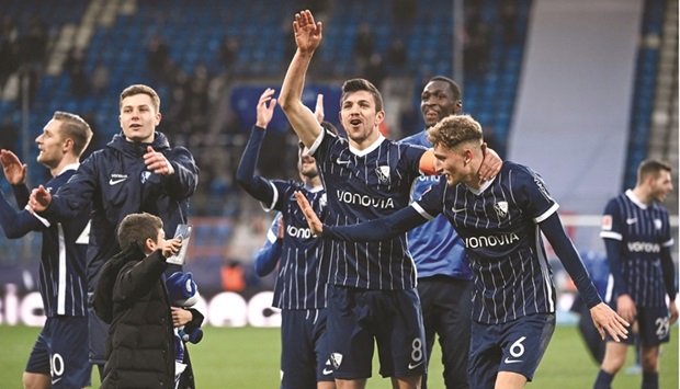 Bochumu2019s players celebrate after their victory over Bayern Munich in the Bundesliga in Bochum, western Germany, yesterday. (AFP)