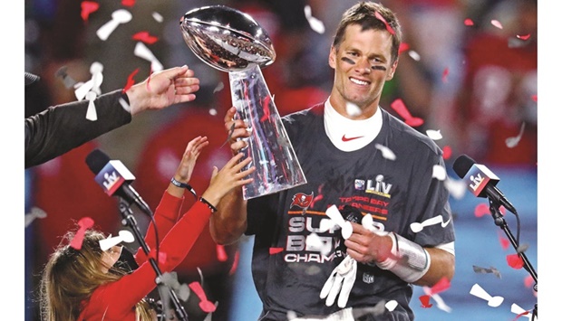 Tampa Bay Buccaneers quarterback and NFL icon Tom Brady celebrates with the Vince Lombardi Trophy after beating the Kansas City Chiefs in Super Bowl LV at Raymond James Stadium. (Reuters)