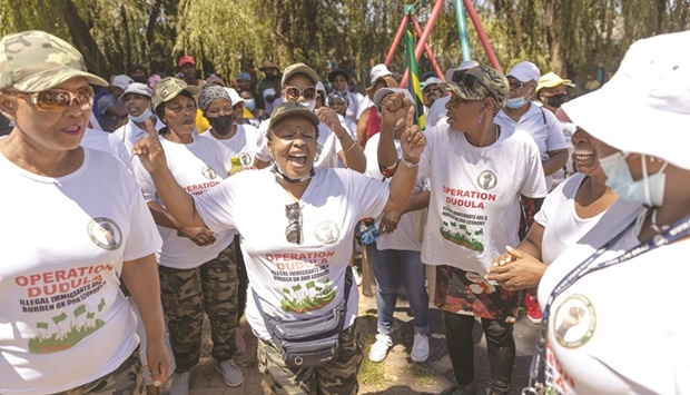 Members of the anti-foreignersu2019 movement, the so called u2018Operation Dudulau2019 shouts xenophobic slogans during a gathering at a park in Orange Grove in Johannesburg, yesterday.