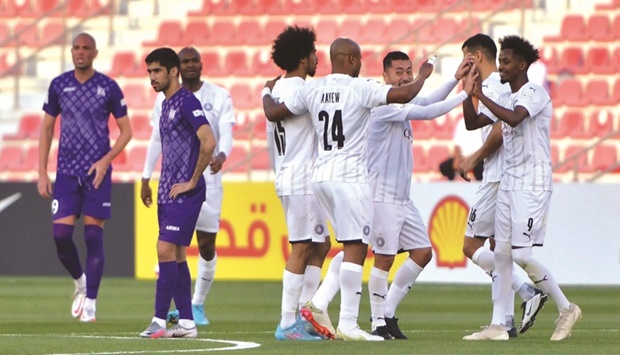 Al Sadd Youssef Abdul Razzaq (right) celebrates with teammates after scoring against Muaither in their Amir Cup football tournament at the Grand Hamad Stadium on Sunday. PICTURE: Noushad Thekkayil